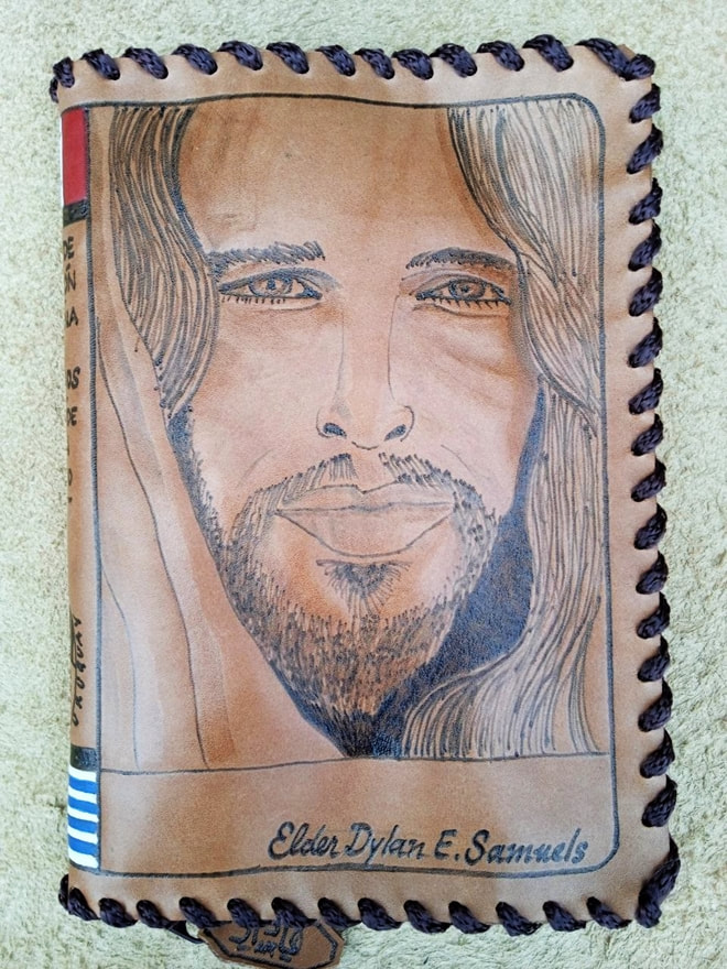 Leather scripture cover with a detailed pyrography portrait