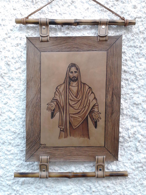 Leather hanging scroll with a pyrography of Christ, mounted on bamboo rods