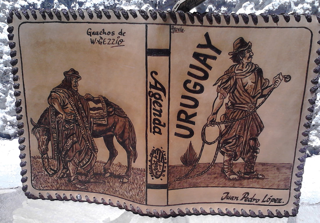 Hand-laced cowhide agenda with pyrography of Uruguayan gauchos, horse, and lasso